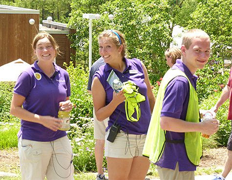 Sara, Kristin, Ryen (Rangers, Guest Relations) at the celebrating insects in front of the Butterfly House.
