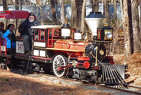 Richard H (Guest Relations) engineer the train through the woods on the way to the train tunnel, Toot-Toot!