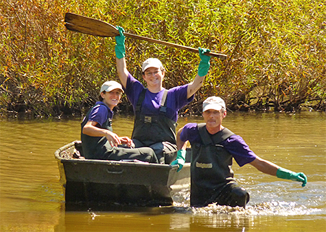 Robin (formerly Butterfly House), Leslie (formerly Operations), and Uli (Butterfly House) on their way to cut back lotus plants in the Wetlands.