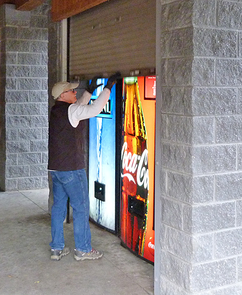 Wayne (Facilities) puts to bed the vending machines at the end of the day in Explore the Wild.