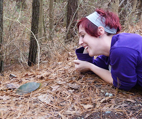 Animal Keeper Katie is delighted to see the little male slider.